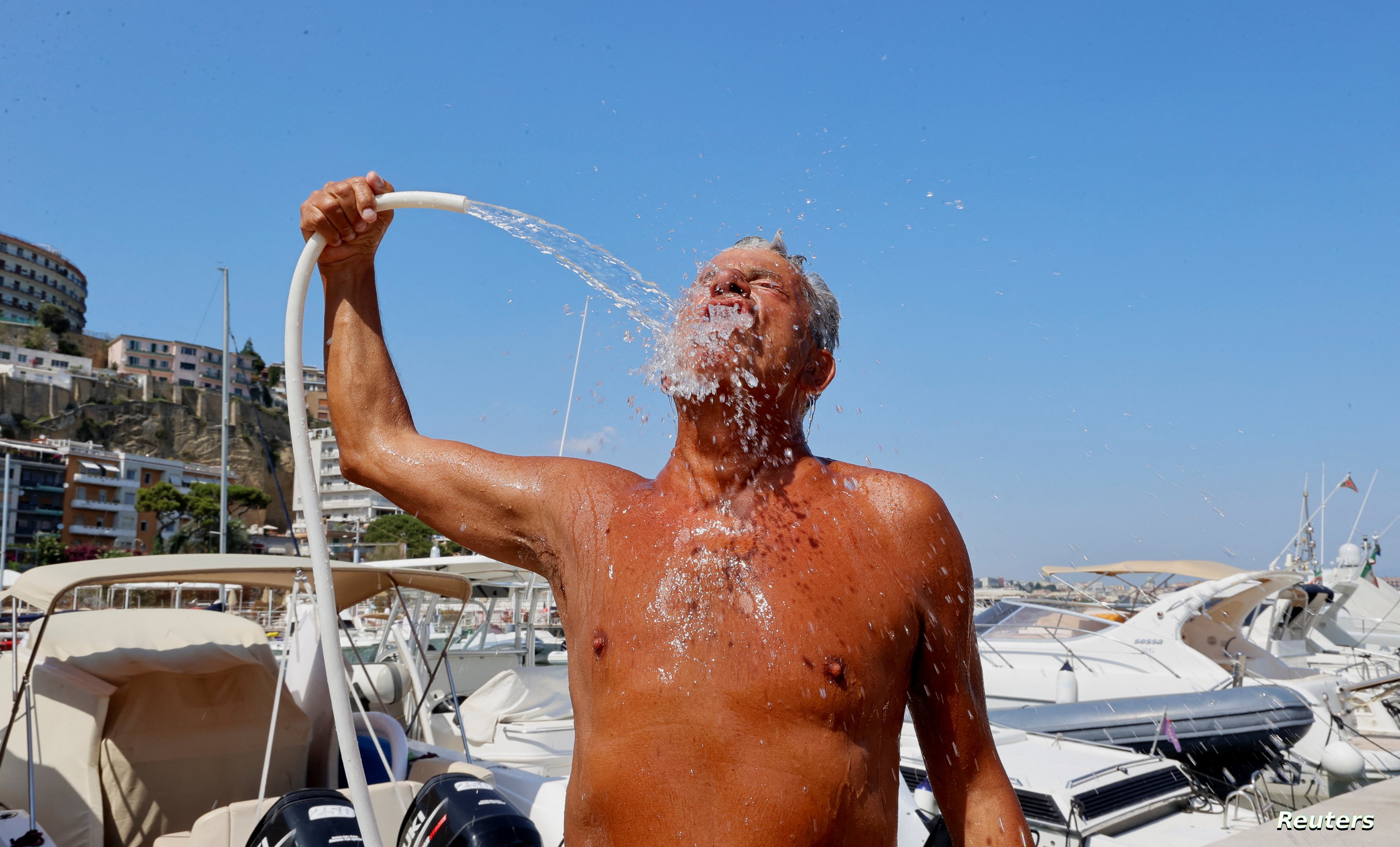 Neapolitans cope with African heat wave as temperatures approach 40 degrees Celsius, in Naples