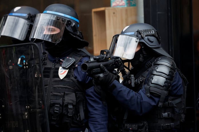 Security forces used tear gas during a protest against pension reform in Paris

