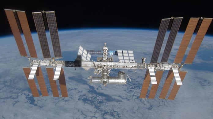 The Crew Dragon spacecraft docked to the ISS with a Russian cosmonaut on board

