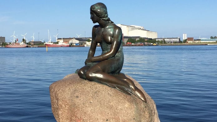 The base of the Little Mermaid statue in Copenhagen has been painted in the colors of the Russian flag

