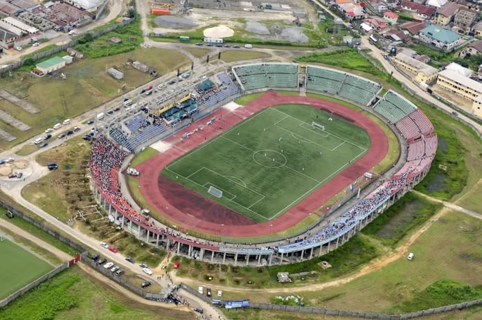 Aerial view of the majestic stadium hosting a thrilling football match