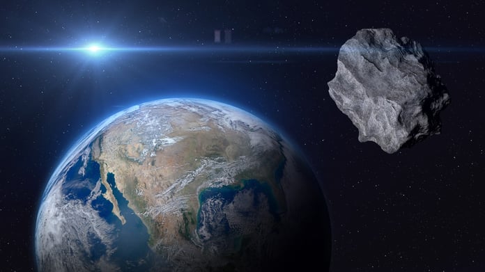 Illustration of near-Earth asteroid 2023 MU2 passing safely by Earth