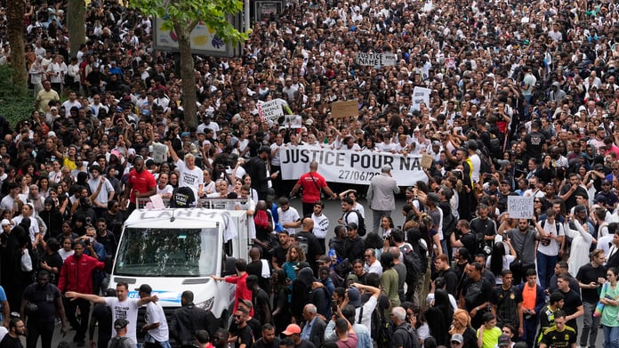 Mounia, grieving mother whose son was killed by the French police, stands atop a van during a march in Nanterre