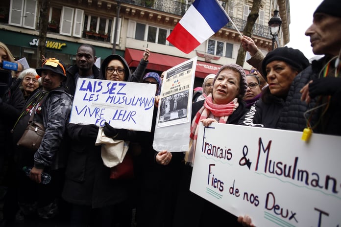 Protestors holding placards during an anti-islamophobia demonstration in Paris, France
