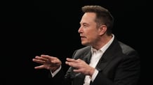 Elon Musk, CEO of SpaceX and Tesla, in a black suit